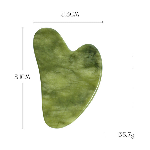 Green jade gua sha board for natural facial care

