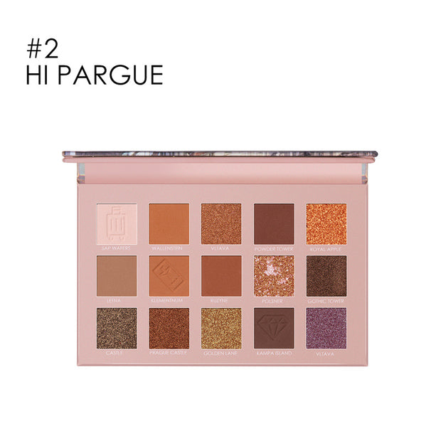 Travel-size eyeshadow palette displayed on beauty set


