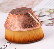 Top view of rose gold Magic Foundation Brush-Save Powder with soft dense fibers and textured handle, designed for precise makeup blending.