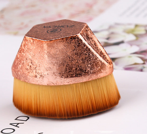 Top view of rose gold Magic Foundation Brush-Save Powder with soft dense fibers and textured handle, designed for precise makeup blending.
