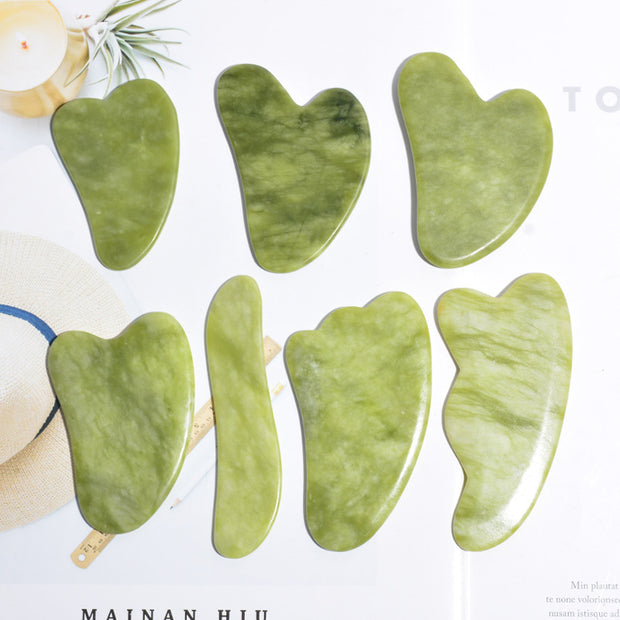 Green jade gua sha massage board for facial skincare

