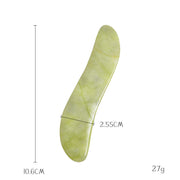 Green jade gua sha tool promotes circulation and relaxation


