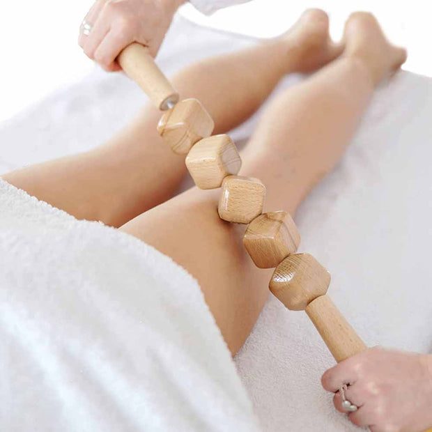 3 wooden massage tools displayed on spa background

