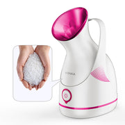 Facial steamer releasing gentle steam for skincare
