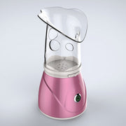 Home facial steamer releasing warm mist for skincare
