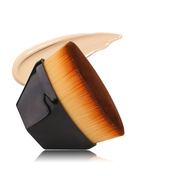 Black Magic Foundation Brush-Save Powder with cream foundation swipe, showcasing dense soft fibers for smooth application.