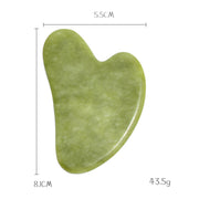 Traditional jade gua sha stone for skincare routine


