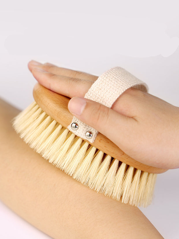 Natural bristle bath brush displayed on bathroom set

