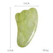 Green jade gua sha tool promotes circulation and relaxation

